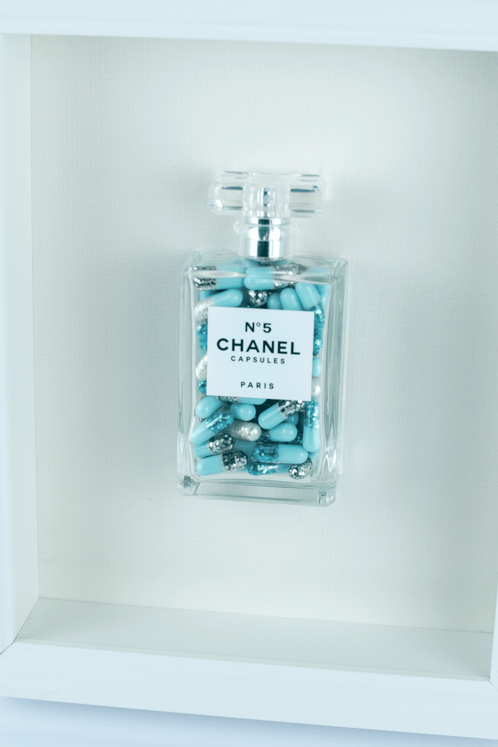 Chanel No.5 Capsules - (White Frame / Blue Pills) by Emma Gibbons